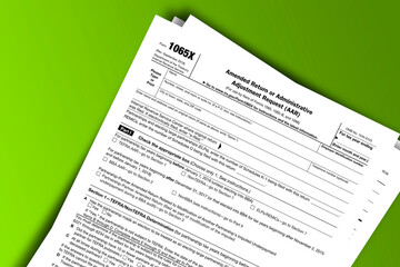 Obraz premium Form 1065-X documentation published IRS USA 10.30.2018. American tax document on colored