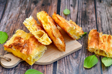 Fresh baked home made  Cheese Puff pastries.Cheese pie with phyllo pastry and  white cheese.