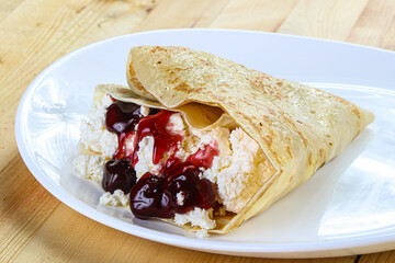 Pancake with cottage cheese and jam