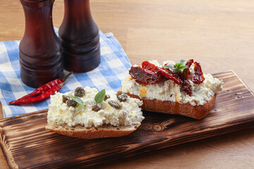 bruschetta with soft cheese capers and tomato