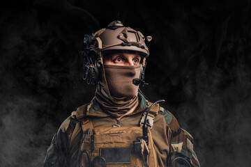 Headshot of soldier dressed in camouflage uniform with helmet