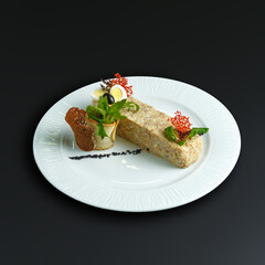 traditional dishes of European cuisine, delicacy, banquet snack. culinary dishes on a white plate on a black background. restaurant service