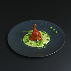 traditional dishes of European cuisine, delicacy, banquet snack. culinary dishes on a white plate on a black background. restaurant service