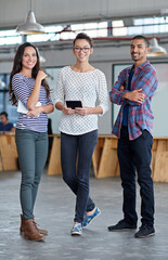 Obraz premium Were ready to take it on. Full length portrait of three creative coworkers smiling confidently at the camera.