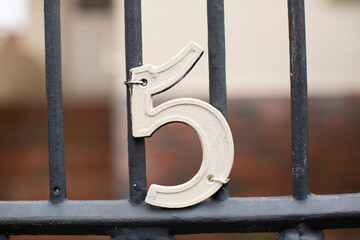 Number Five mounted on a gate