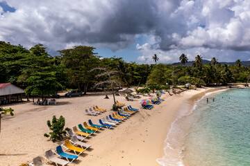 a tropical island with a snow-white beach and a turquoise sea in the Dominican Republic filmed from a drone 