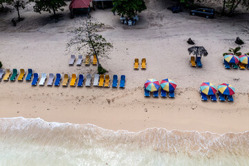 a tropical island with a snow-white beach and a turquoise sea in the Dominican Republic filmed from a drone 