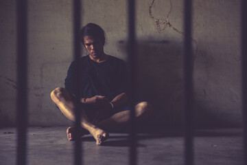 criminal tying hands with handcuffs.