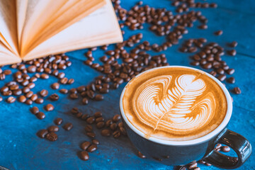 coffee latte art on wood table, relax time, cafe barista art top view.