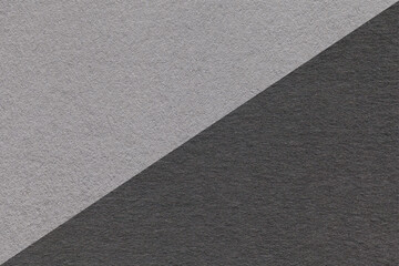 Texture of craft gray and black paper background, half two colors, macro. Structure of vintage...