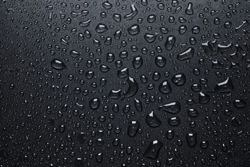 Black teflon texture with water or oil drops