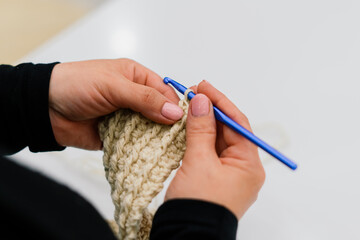 Process of knitting isolated on white, female hands