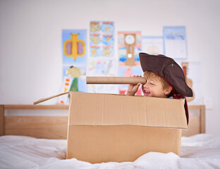 Thar she blows. Shot of a young boy playing make believe as a pirate.