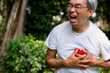 asian older man chest pain.life insurance , retirement.