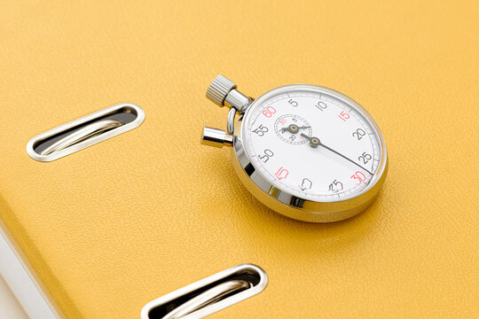 Yellow office folder on the chronometer.