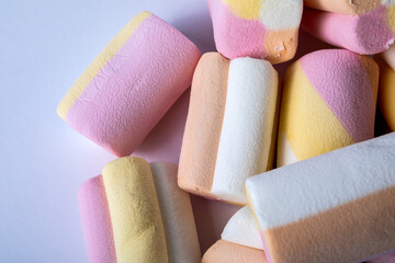 Pieces of marshmallow stacked on a white background