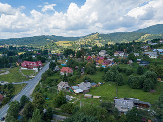 Fototapeta na wymiar Settlement in the mountains of the Ukrainian Carpathians. Aerial drone view.