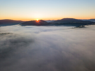 Morning fog in the Ukrainian Carpathians. Aerial drone view.
