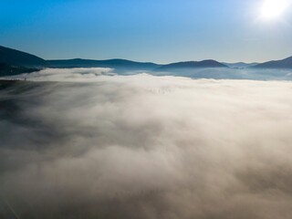 Morning fog in the Ukrainian Carpathians. Aerial drone view.