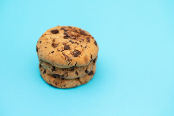 fresh sweet cookies with chocolate drops on blue