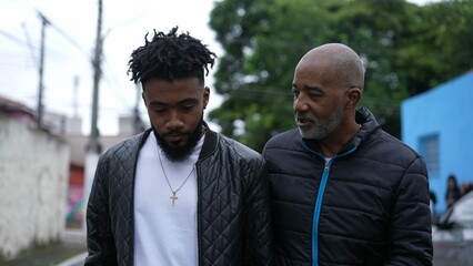 Father and son walking together bonding talk