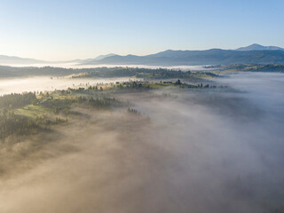 Morning fog in the Ukrainian Carpathians. Aerial drone view.