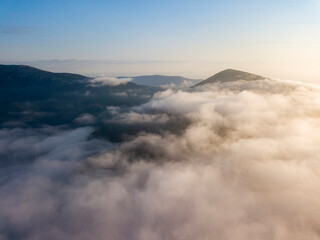 Obraz premium Morning fog in the Ukrainian Carpathians. Aerial drone view.