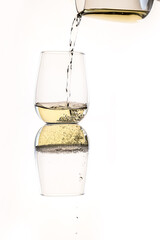 white wine or apple juice in a transparent glass isolated over white background