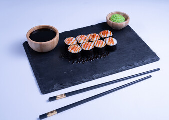 Sushi Maki rolls salmon. Fresh hosomaki pieces with rice and nori. Close Up of delicious japanese food with sushi roll.