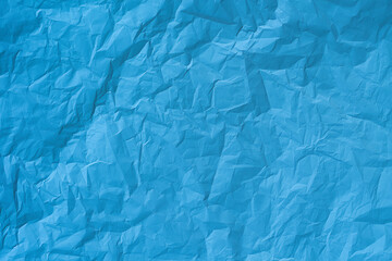 Blue crumpled paper texture background. 