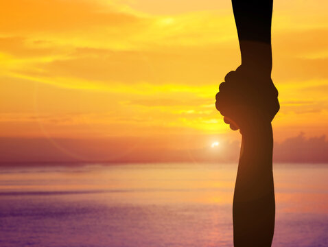 handshake help and hope and international peace day concept silhouette