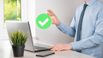 Hand holds green icon Check mark,Check Mark Sign, Tick Icon,right sign,circle green checkmark button,Done.On dark background.Banner.Copy space.Place for text.