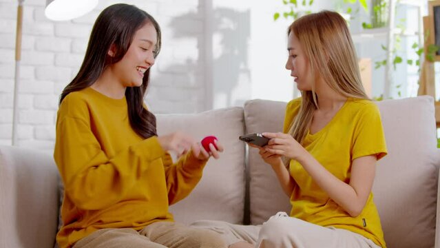 An Asian lesbian is surprise her partner by give her a ring and also her partner was shocked and happy. They spend time together as a normal couples and LGBT conceptual are.Good moment