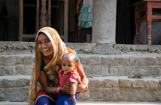 Happy Mother And Her Child In Rural Village, India