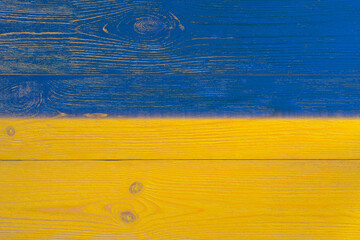 ukrainian flag painted over wooden planks
