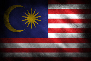 The flag of Malaysia on a grunge background