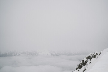 Part of the lift up the mountain, winter cloudy day with fog.