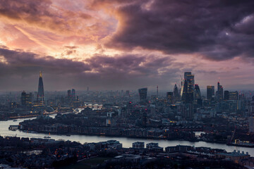 Naklejka premium Wide panorama of the illuminated London city skyline during dusk, England
