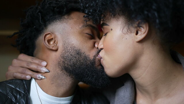Passionate kiss a black couple kissing an African man and woman love