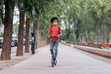 Afro American Boy Riding Electrical Scooter