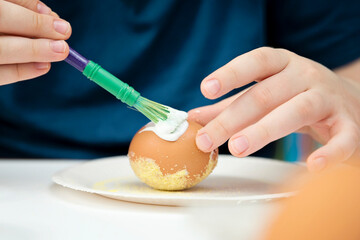 Easter. a Christian religious holiday. Egg mottle with different color salt. Tradition to variegate with various colors and various techniques. Global spring fest.