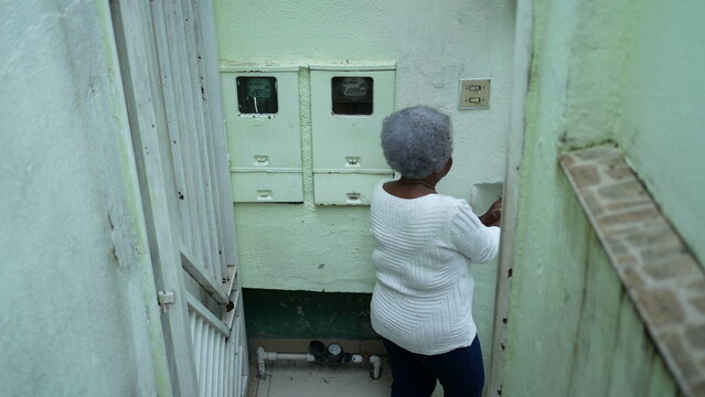 A Senior Black Woman Leaving House Person Opening Front Door