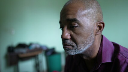 A preoccupied person an African senior man having despair and anxiety