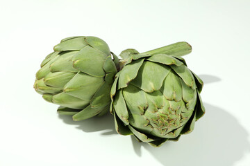 Concept of healthy food with artichoke on white background
