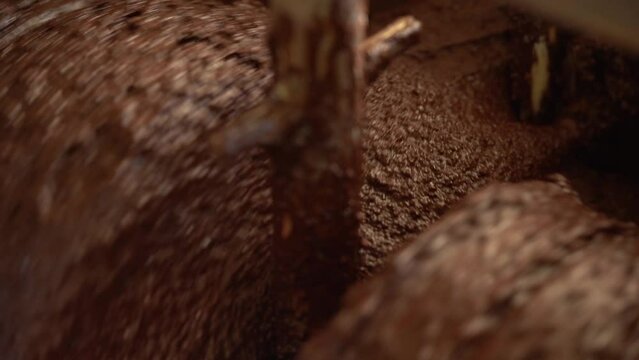 Chocolate Texture And Flavor Being Developed With A Conching Machine In A Factory. macro