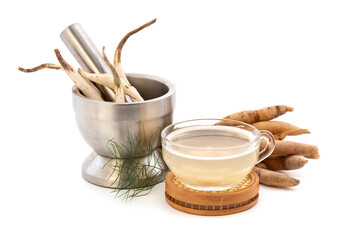 Shatavari or Asparagus racemosus roots and juice isolated on white background.