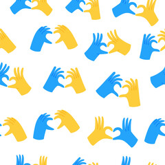 Hands in heart form in Ukraine flag color
