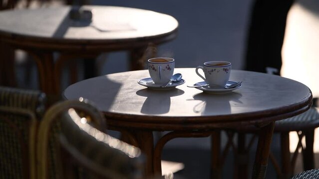 4k video. Two cups of espresso coffee on a coffee shop terrace from Paris, France.