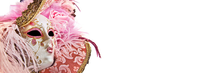 Close up of a pink woman venetian mask isolated on panoramic white background