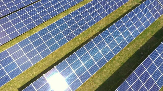 Closeup of surface of blue photovoltaic solar panels for producing clean ecological electricity. Production of renewable energy concept aerial